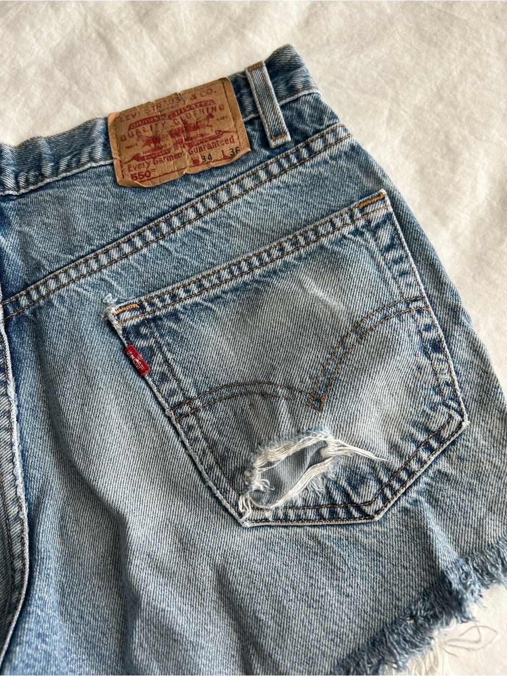 Levi's 550s Light Wash Distressed Denim Cutoff Shorts - Picture 9 of 15